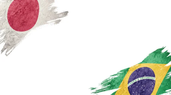 Flaggen von Japan und Brasilien auf weißem Hintergrund — Stockfoto